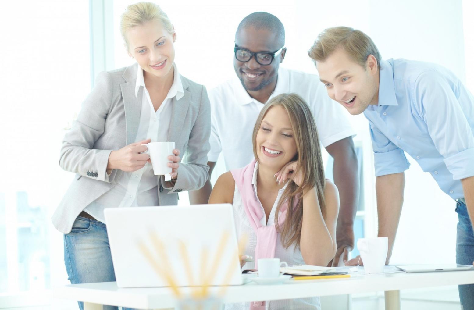 Students collaborating on financial analysis project using professional software tools