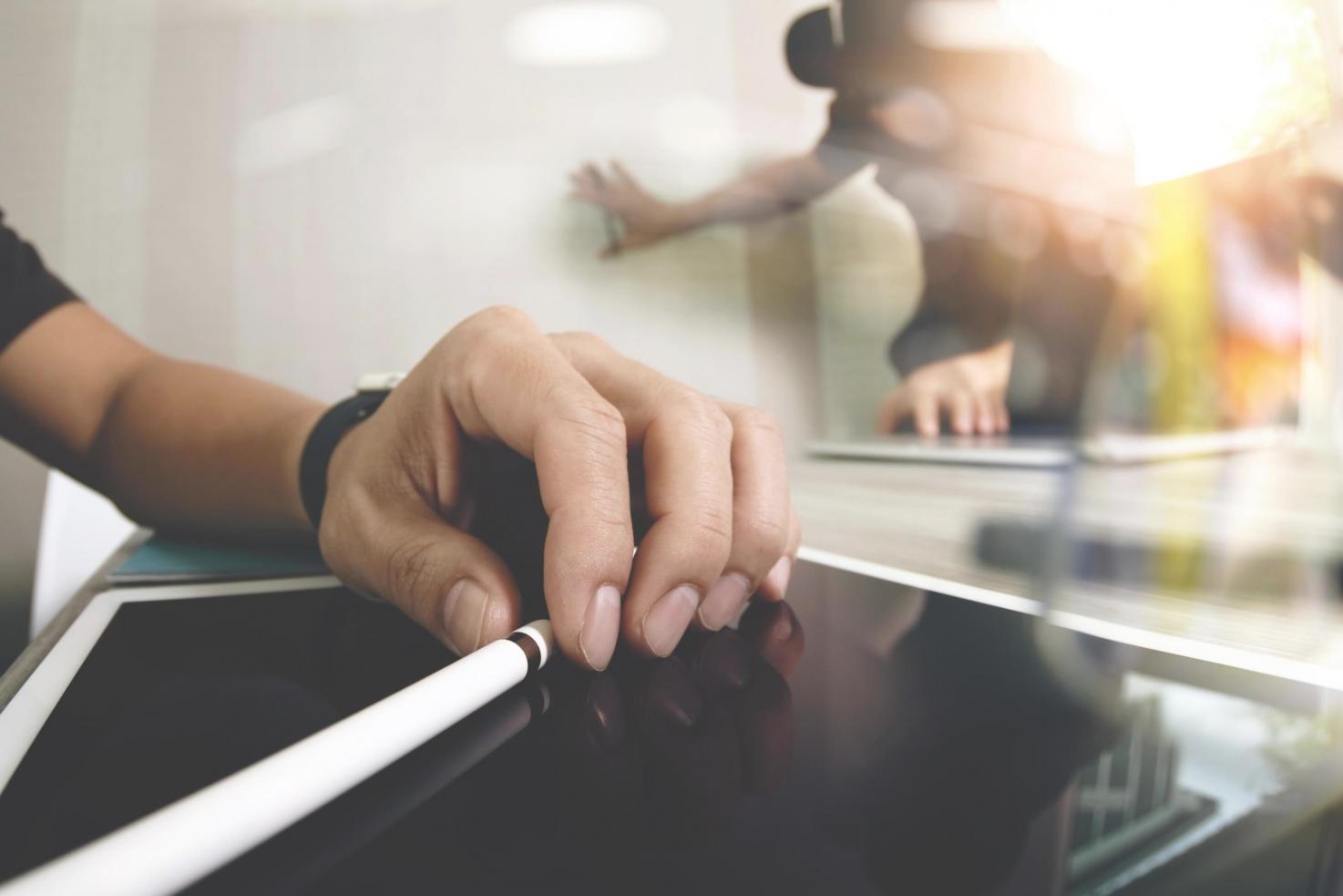 Team collaboration session reviewing financial software interface designs