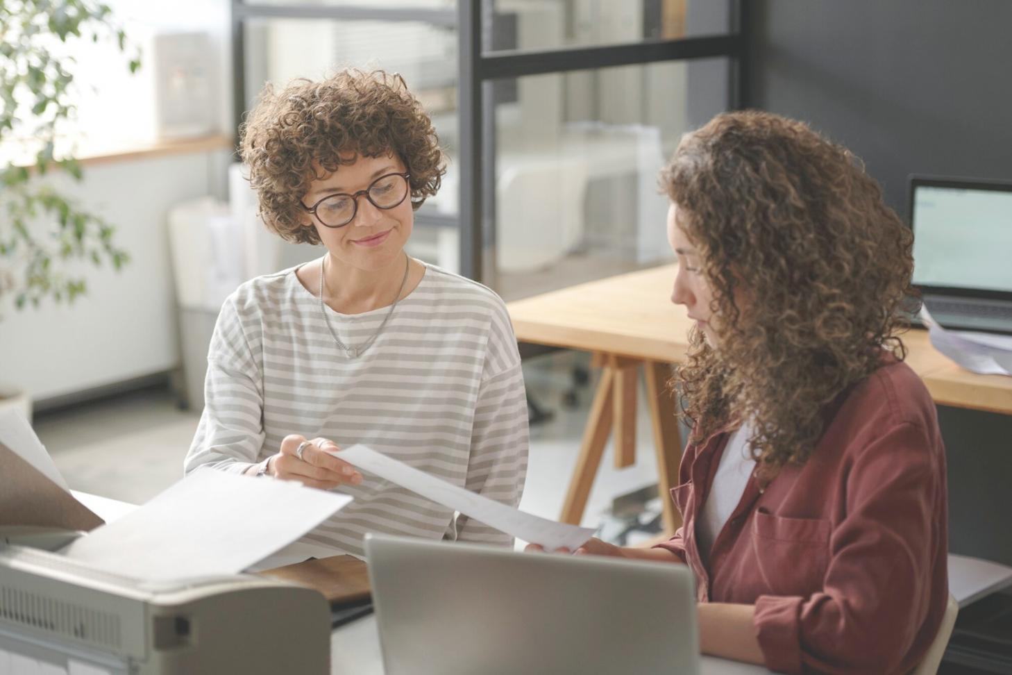 Business professionals reviewing financial reports and analysis charts